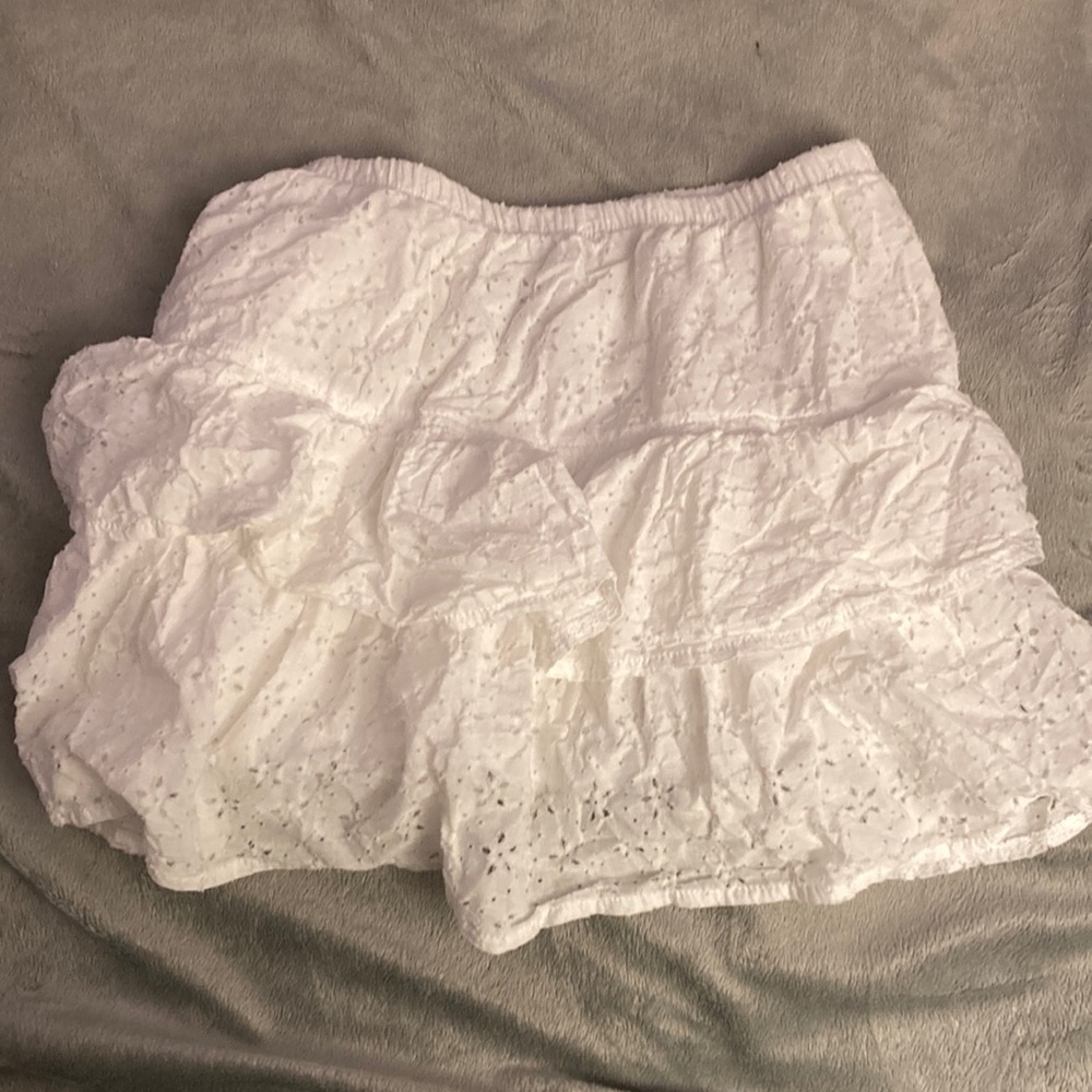 Product :Clothes Brand: Rue 21 Size : Small white mini skirt.